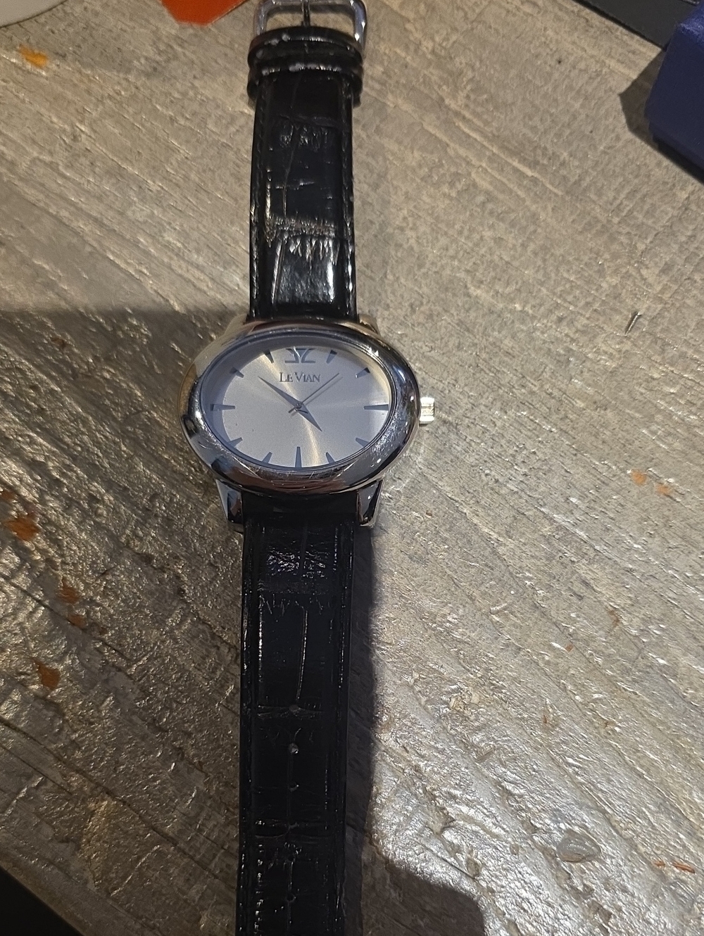 Levian Black Leather Strap Silver Dial Oval Watch